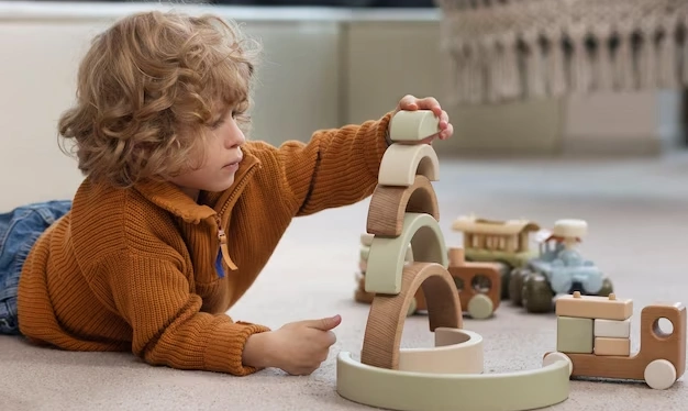 A boy child playing with lego